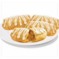 Four Apple Pies · Juicy apple slices sprinkled with cinnamon and wrapped in a flaky crust that will make your ...