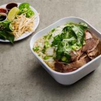 9. Pho Bo · Beef noodle soup. Choose a meat. Them bo vien - add 4 pieces beefball for an additional char...