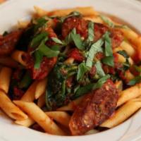 Penne with Spicy Sausage · Broccoli rabe and plum tomatoes.