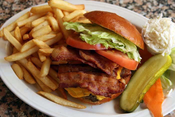 Cheeseburger Deluxe · All deluxes served with french fries, lettuce, tomato, coleslaw and pickle. 