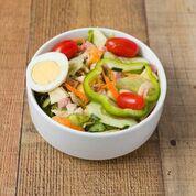 4. Chef Salad · Mixed greens, cucumbers, peppers, cherry tomatoes, shredded carrots, hard-boiled egg with slices of delicious fresh roasted turkey, ham and mixed cheeses.