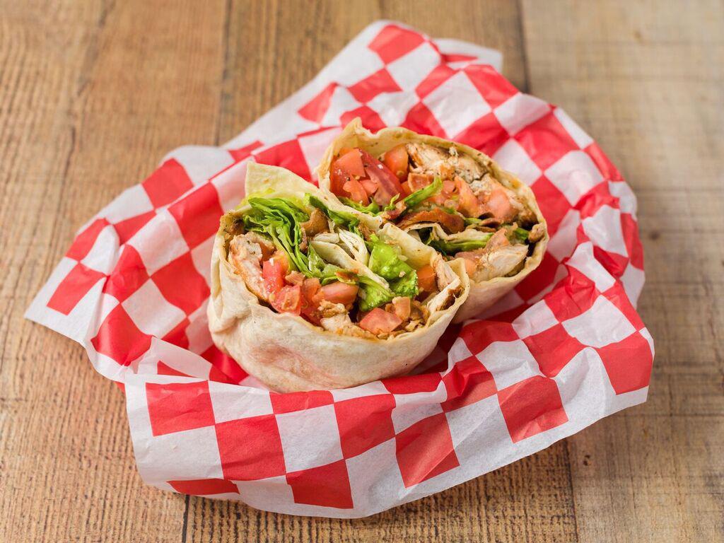 12. Chicken Breast Club Wrap · Grilled chicken breast, bacon, lettuce, tomatoes and basil mayonnaise, wrapped in a flour tortilla.