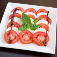Caprese Salad · A true Italian salad made with fresh mozzarella, fresh basil, tomatoes and extra virgin oliv...