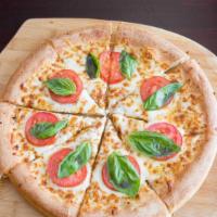 Margherita Pizza · Olive oil base, fresh basil, garlic, tomatoes, Parmesan and mozzarella cheeses.