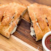 Create Your Own Calzone · Add your favorite pizza toppings to our mozzarella and ricotta base. 