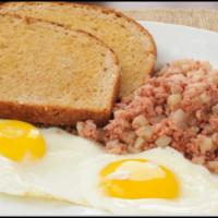 Eggs Corned Beef Hash  On A Plate & Side Toast  · Eggs, corned beef hash and toast on a plate. Add-ons extra 