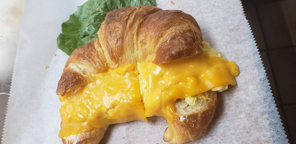 Egg and Cheese Croissant · Eggs and cheese croissant sandwich. Add-ons extra. 