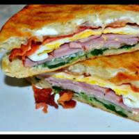Loaded Breakfast Panini Sandwich (eggs mozzarella ham bacon spinach & tomatoes) · Eggs,mozzarella, ham,bacon spinach & Tomatoes. Add-ons extra. 