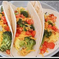 Eggs Broccoli Tomatoes & Shredded Cheddar Tacos  · Choose your favorite side Dressing. Salsa Verde or mild salsa. Add-ons extra. 