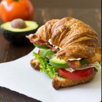  Avocado Club Gourmet Croissant Sandwich (turkey avocado bacon romaine lettuce tomatoes) · boar's Head Turkey Breast, avocado, crisp bacon, romaine lettuce, tomatoes on croissant. Cho...