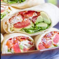 BLT Wrap With Avocado & Mozzarella Cheese  · Bacon lettuce and tomatoes wrap with avocado and fresh mozzarella. Choose your favorite dres...