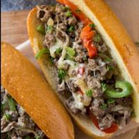 Philly Cheese Steak Sandwich (beef strips onions peppers & cheese) · Beef strip, onions, peppers and melted cheese.  Choose your favorite dressing. Choose your f...