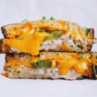  Classic Tuna Melted Vermont Cheddar Tomatoes Sandwich  · your Choice of classic tuna or spicy classic tuna melted Vermont Cheddar with tomatoes. Choo...