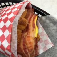 Bacon, Cheese and Egg Croissant Sandwich · Cured pork. Served on a flaky French pastry. 