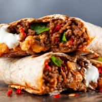 Grilled Steak Burrito · Our signature burrito served with grilled chicken, beans, rice, pico de gallo, melted cheese...