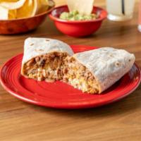 Carnitas Burrito · Pork. Our signature burrito served with grilled chicken, beans, rice, pico de gallo, melted ...