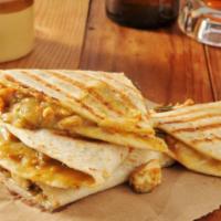 Grilled Chicken Quesadilla · A large handmade flour tortilla stuffed with a blend of melted cheese and pico de gallo. Ser...