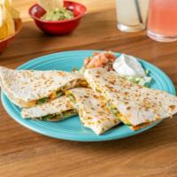 Carnitas Quesadilla · A large handmade flour tortilla stuffed with a blend of melted cheese and pico de gallo. Ser...