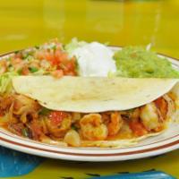 Shrimp Quesadilla · A large handmade flour tortilla stuffed with a blend of melted cheese and pico de gallo. Ser...