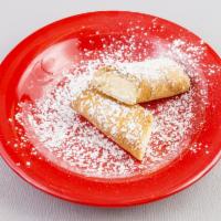 #104. Cheesecake Burrito · Fried burrito with cheesecake filling topped with powdered sugar.