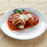 Eggplant Rollatini · Baked with tomato basil sauce with a blend of mozzarella, ricotta, and Parmesan cheese.