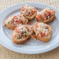 Bruschetta Original · Sliced bread with fresh diced tomatoes, mozzarella, and basil.