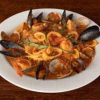 Linguine Pescatore · Shrimp, clams, mussels, tilapia, and calamari in a light tomato basil sauce.