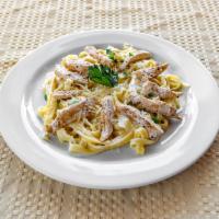 Fettuccine with Chicken Alfredo · Grilled chicken served on top of fettuccine in a traditional Alfredo sauce.
