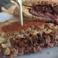 Doherty Melt · A blend of ground beef & fresh ground corned beef served on grilled rye with Swiss cheese, c...