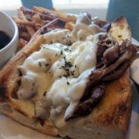 French Dip · Shaved ribeye topped with melted provolone on toasted French bread served with a side of au ...