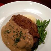Meatloaf · Home made meatloaf topped with our Irish whiskey peppercorn gravy. Served with creamy mashed...