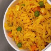 Seasoned Yellow Rice with Vegetables  · Yellow rice seasoned with our house blend and mixed with assorted vegetables 
