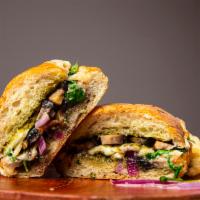 Portobello Sandwich · herb focaccia, pesto, Portobello, balsamic, truffle olive oil, red onions, mozzarella, baby ...