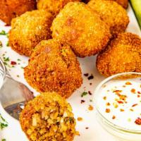 Boudin Balls · Fried boudin rice dressing with a crispy exterior and savory inside. A Cajun classic appetiz...