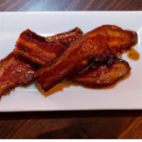 Applewood Pork Belly · Thick cut Nueske’s bacon with maple bourbon glaze