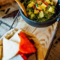Pineapple Guac · Avocados, pinaple, roasted garlic chipotle, red onions, cilantro,tomatoes,jalapenos, mix cit...