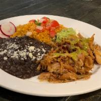 Carnitas  Combo plate · Simmered pork carnitas served with rice, beans topped with queso fresco, and sides of pico d...