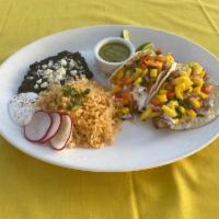 Seafood Taco Combo · Two homemade corn tortilla tacos filled with your choice of fish or shrimp. Served with rice...