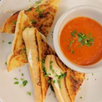 Grilled Triple Cheese  · Cheddar, Swiss, and Provolone on toasted garlic sourdough bread. Served with a side of tomat...