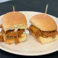 Pulled Pork Sliders  · Pulled pork tossed with a smoked bourbon BBQ sauce, served on slider buns with Gorgonzola an...