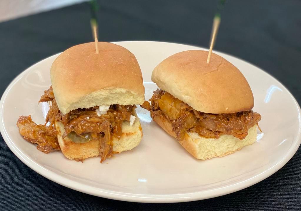 Pulled Pork Sliders  · Pulled pork tossed with a smoked bourbon BBQ sauce, served on slider buns with Gorgonzola and pickles.