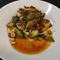 Fried Brussels Sprouts  · Brussels sprouts tossed with toasted hazelnuts and tossed with a sweet chili lime sauce.