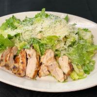 Chicken Caesar Salad  · Grilled lemon marinated chicken breast, crisp romaine lettuce, shaved Parmesan, croutons, ho...