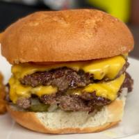 Smash Burger  · 1/4 lb. patty, ground in house, served on a sesame seed bun with roasted garlic aioli, musta...