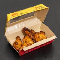 Single Order Wings · Cooked wing of a chicken coated in sauce or seasoning.