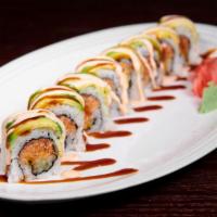 Dragon Roll · Spicy salmon, cucumber topped with avocado, caviar, sweet sauce and spicy mayo.