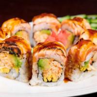 Lava Roll · Spicy kani, avocado, mango topped with Torched salmon, sweet and spicy sauce