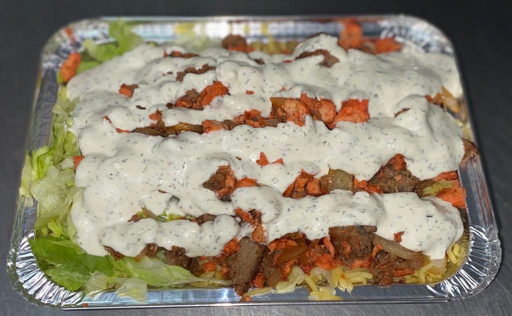 Spicy Mix Over Rice Chicken and Lamb with Free Can Soda · Mixed spicy grilled chicken and lamb served with lettuce, tomatoes, and cucumbers topped with fried onions and our customer favorite white sauce. extra white sauce available upon request.