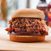 The Heisman Sandwich · Choice of pulled pork or chopped brisket with a slice of bologna and hot link. Served with 1...