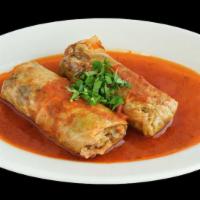 Stuffed Cabbage Roll · Rice, ground meat


, onions and spices served with aromatic tomato sauce.